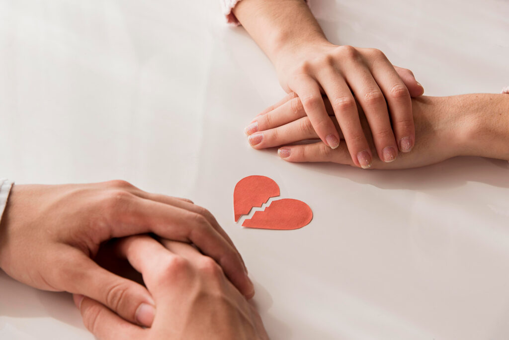 Two hands reaching out to each other.