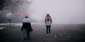 A person walking away peacefully from a toxic relationship